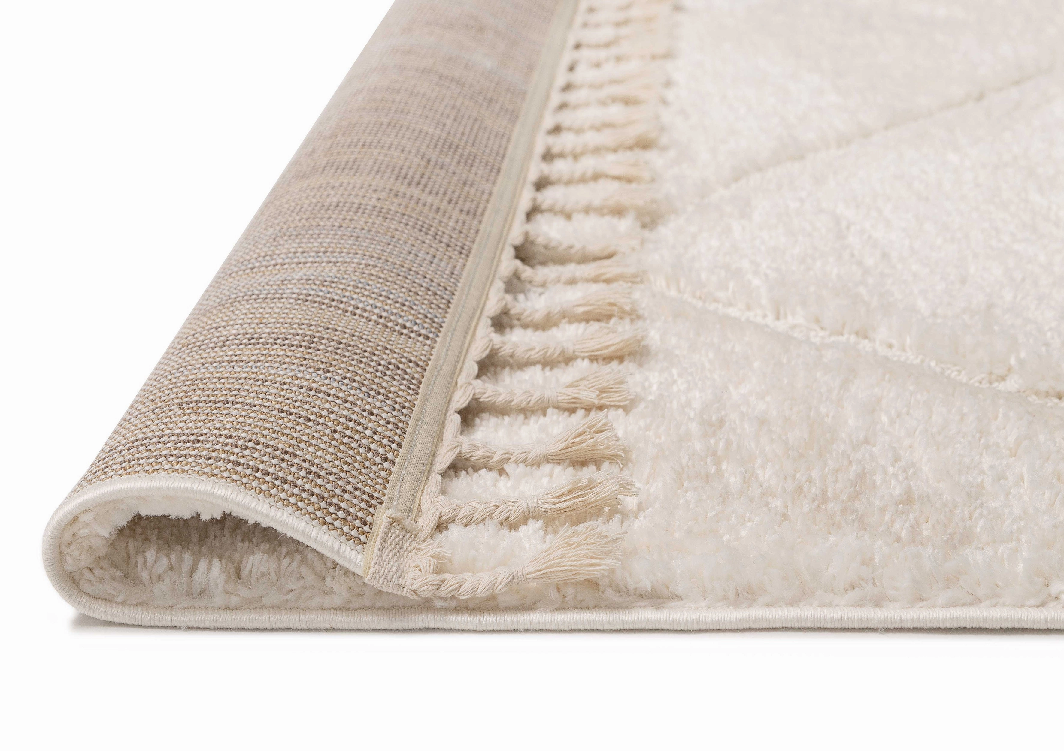 Calypso Ivory Cream Textured Tribal Tassel Rug