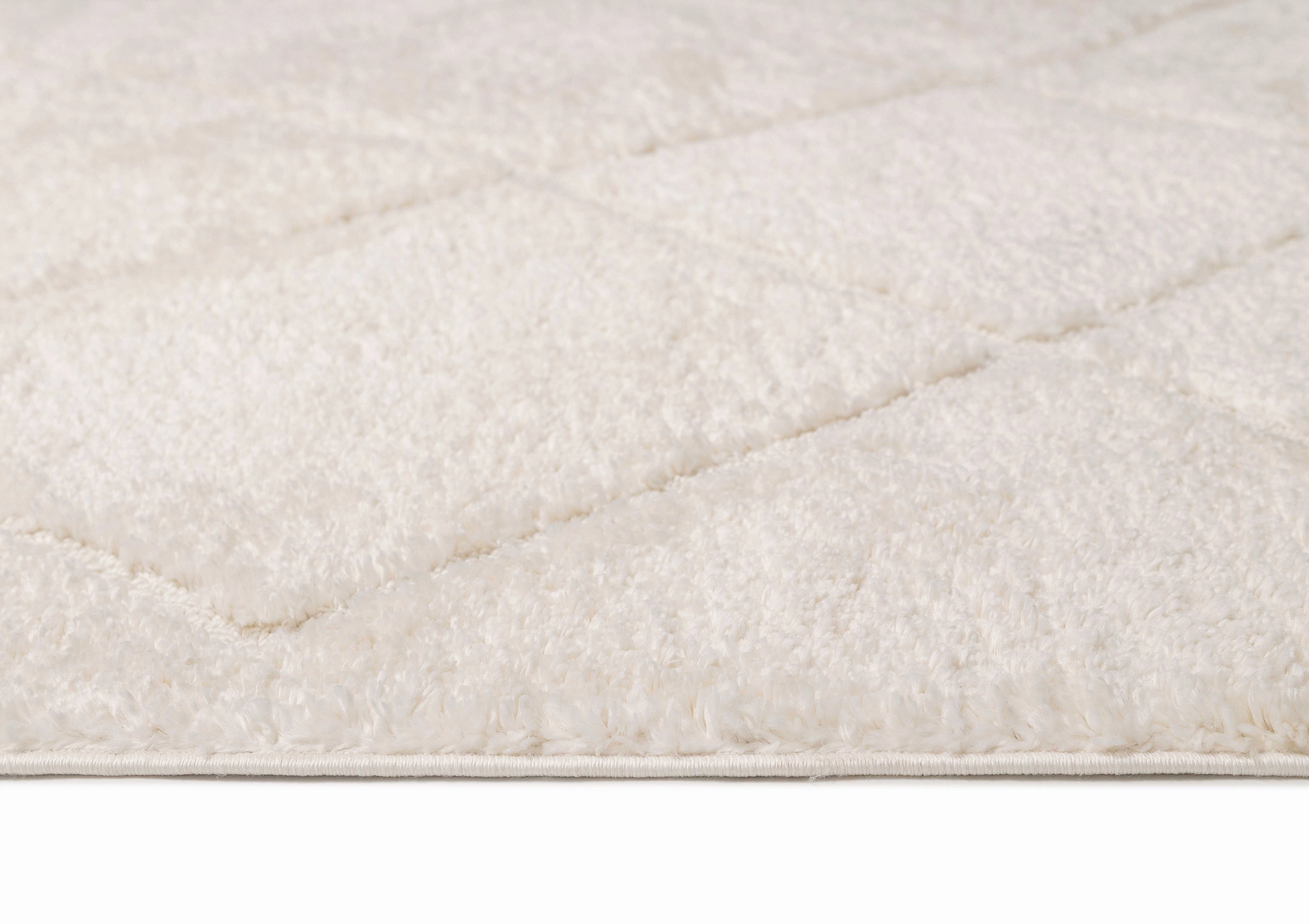 Calypso Ivory Cream Textured Tribal Tassel Rug