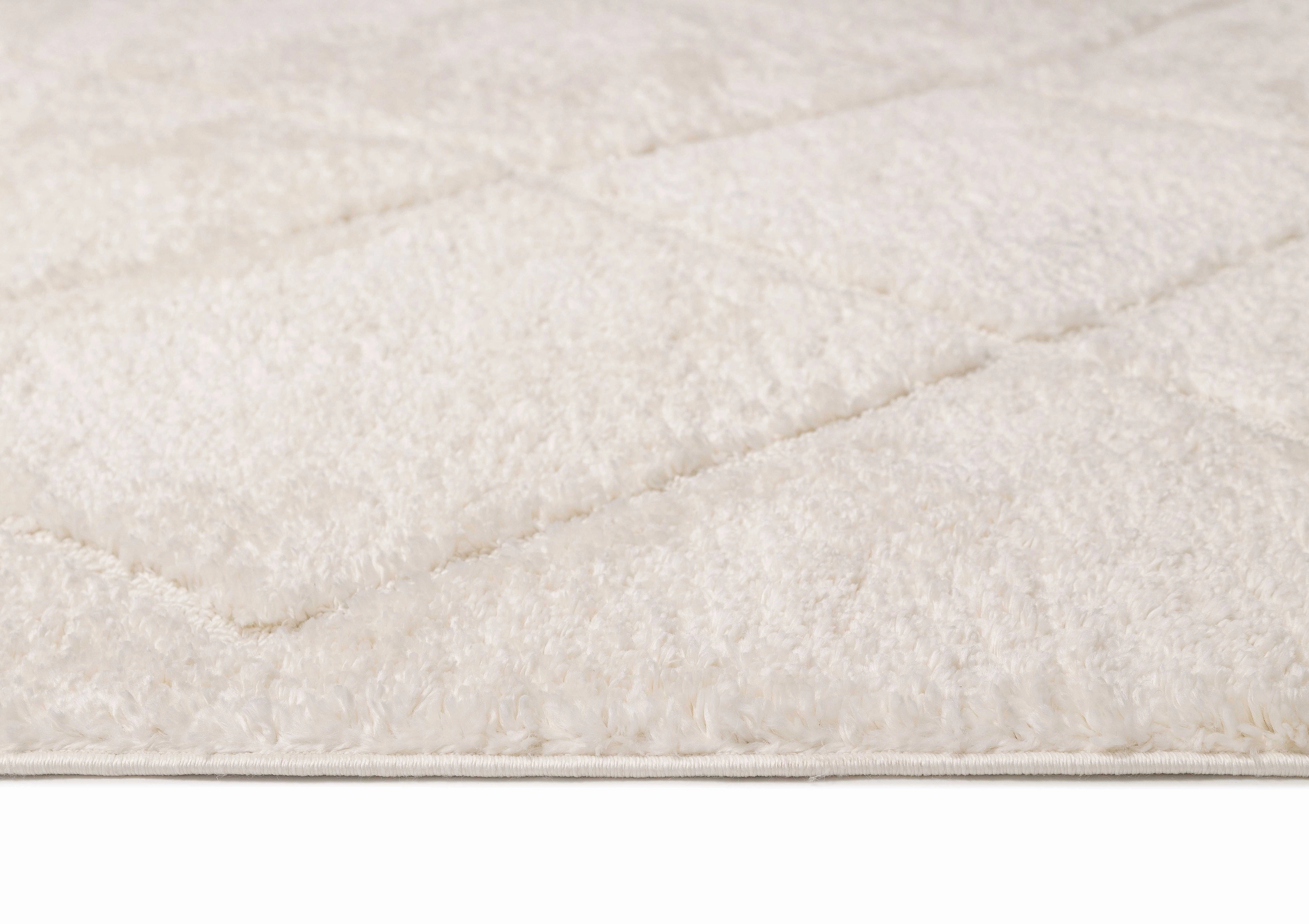 Calypso Ivory Cream Textured Tribal Tassel Rug