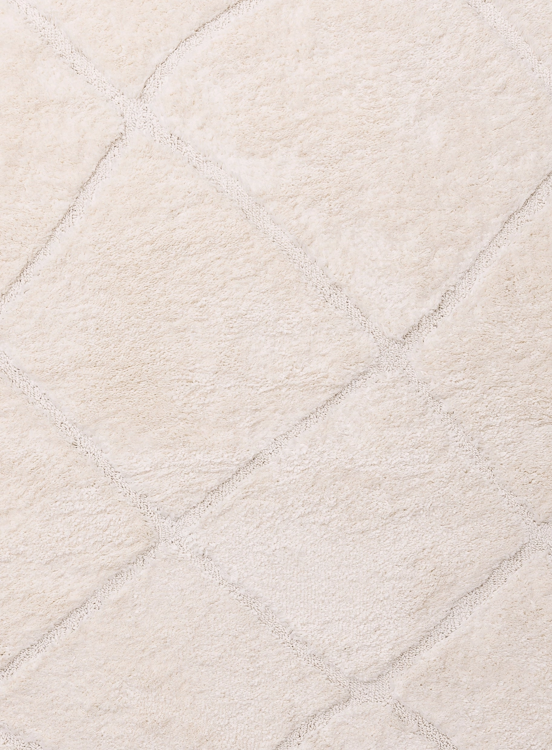 Calypso Ivory Cream Textured Tribal Tassel Rug