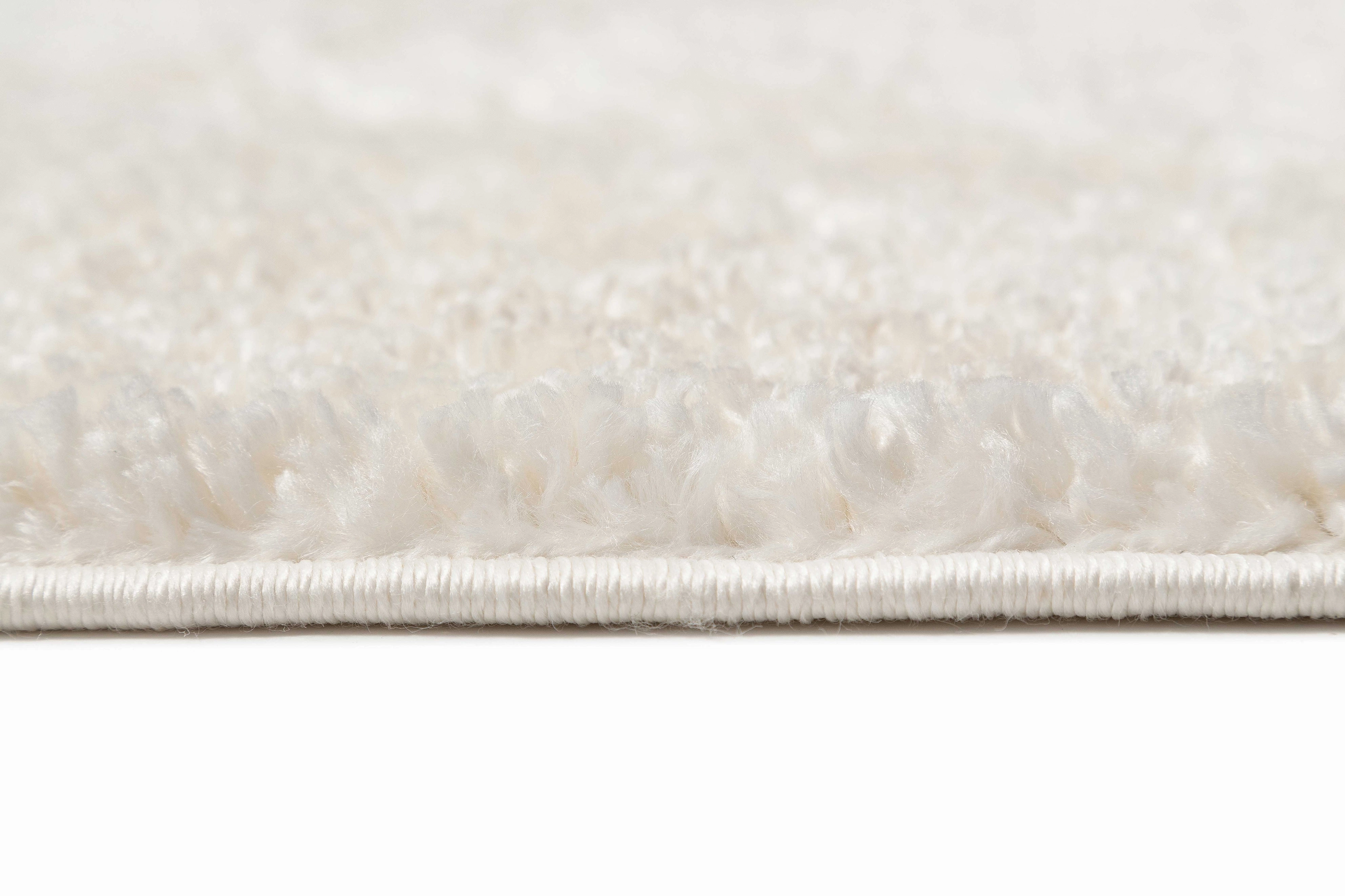 Calypso Ivory Cream Textured Tribal Tassel Rug