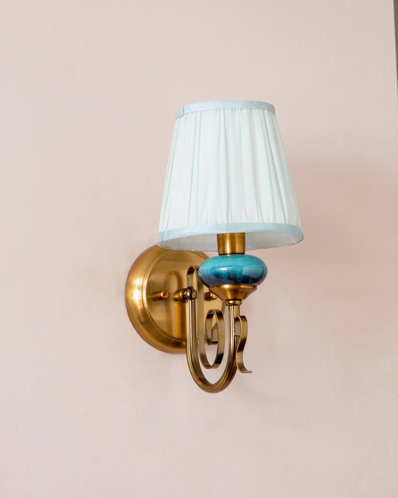 Rustic Gold Wall Sconce With Blue Accent And Fabric Shade