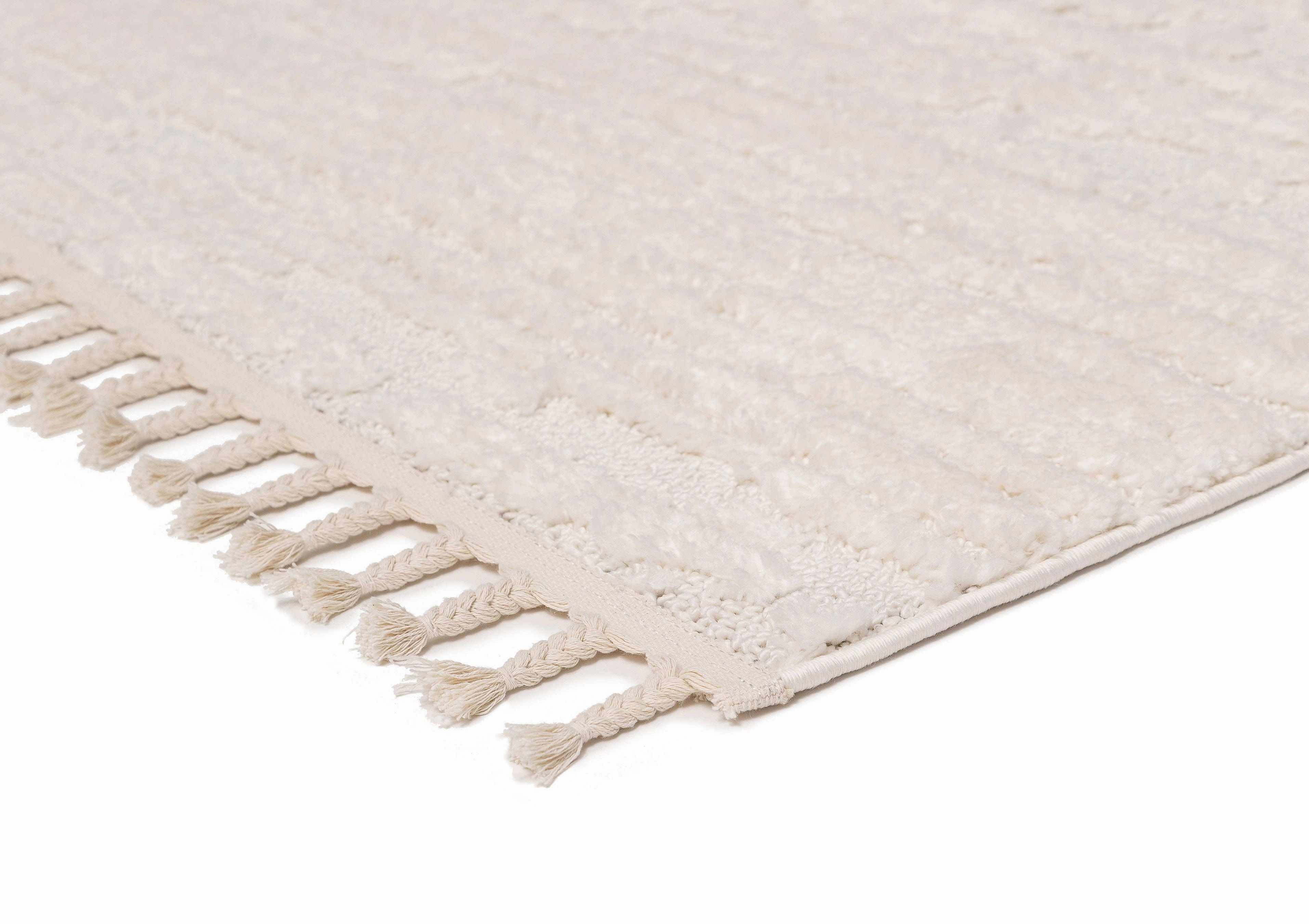 Serena Ivory Cream Textured Tassel Rug