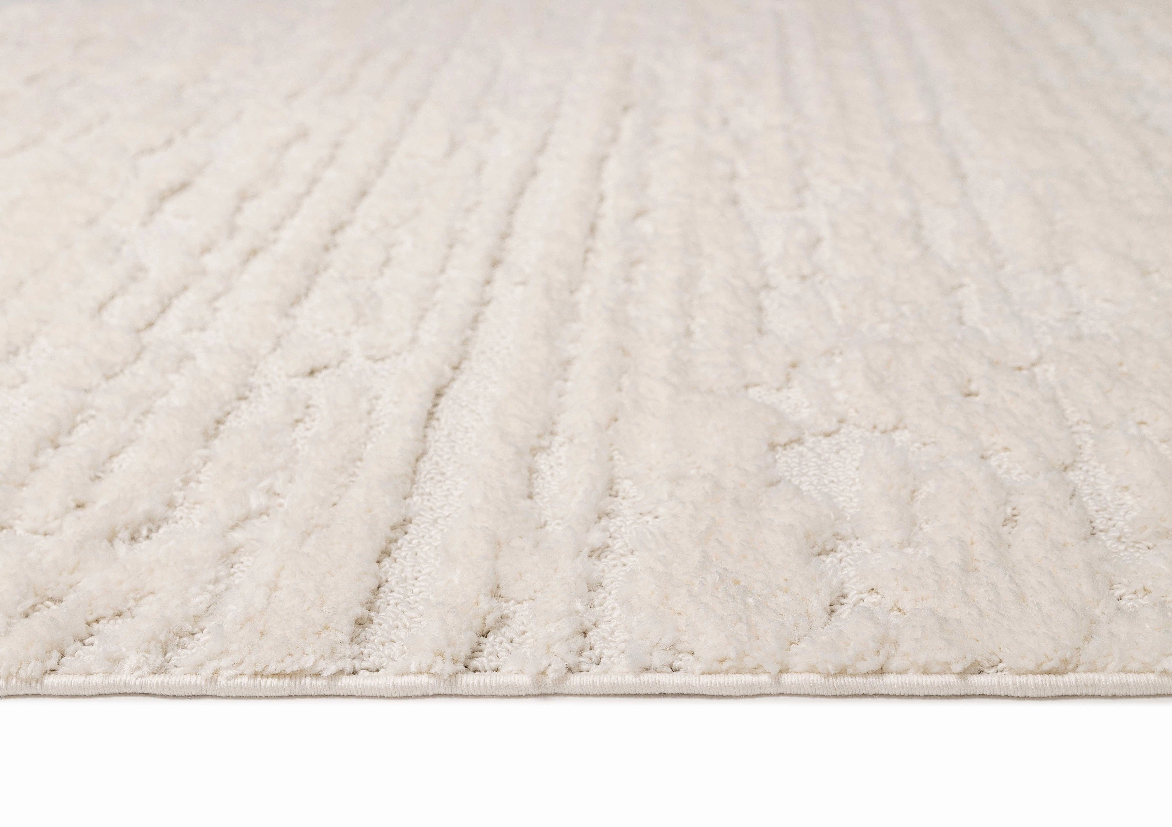 Serena Ivory Cream Textured Tassel Rug