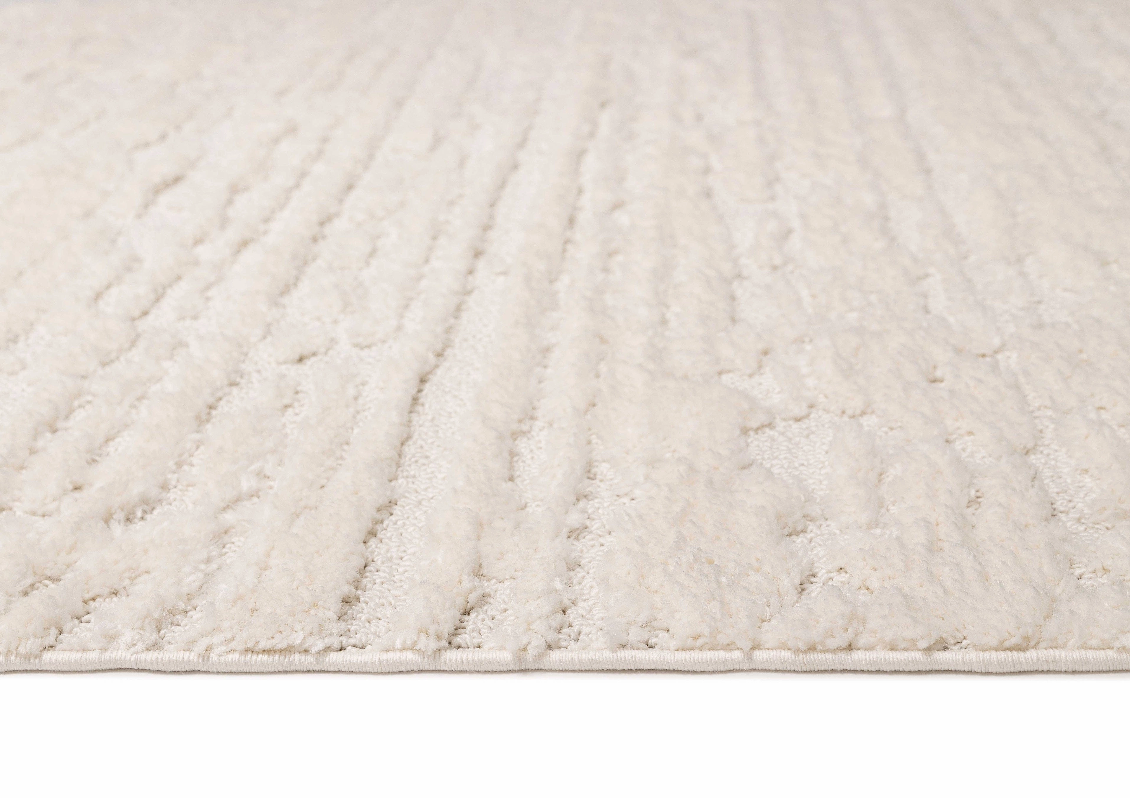 Serena Ivory Cream Textured Tassel Rug