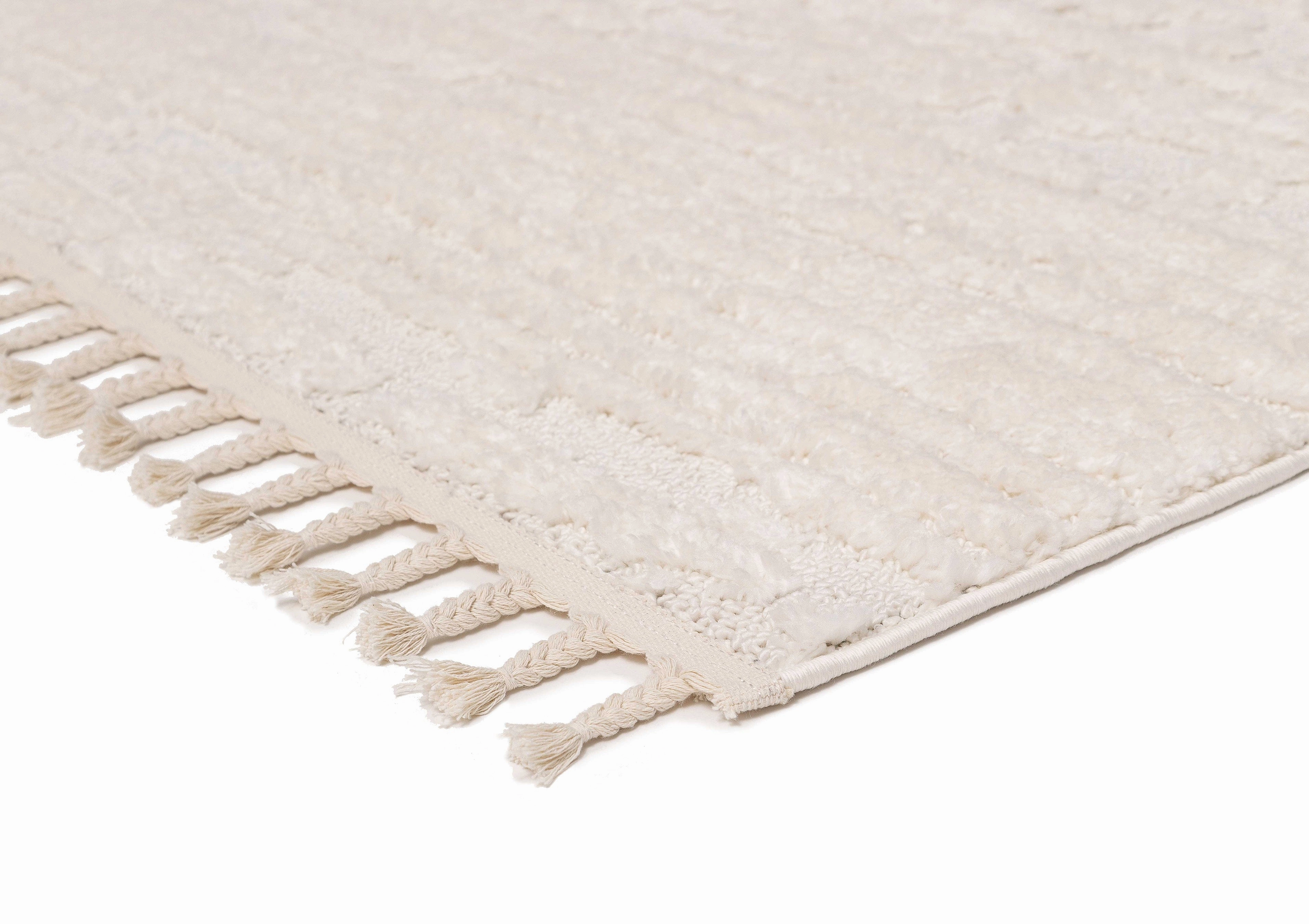 Serena Ivory Cream Textured Tassel Rug