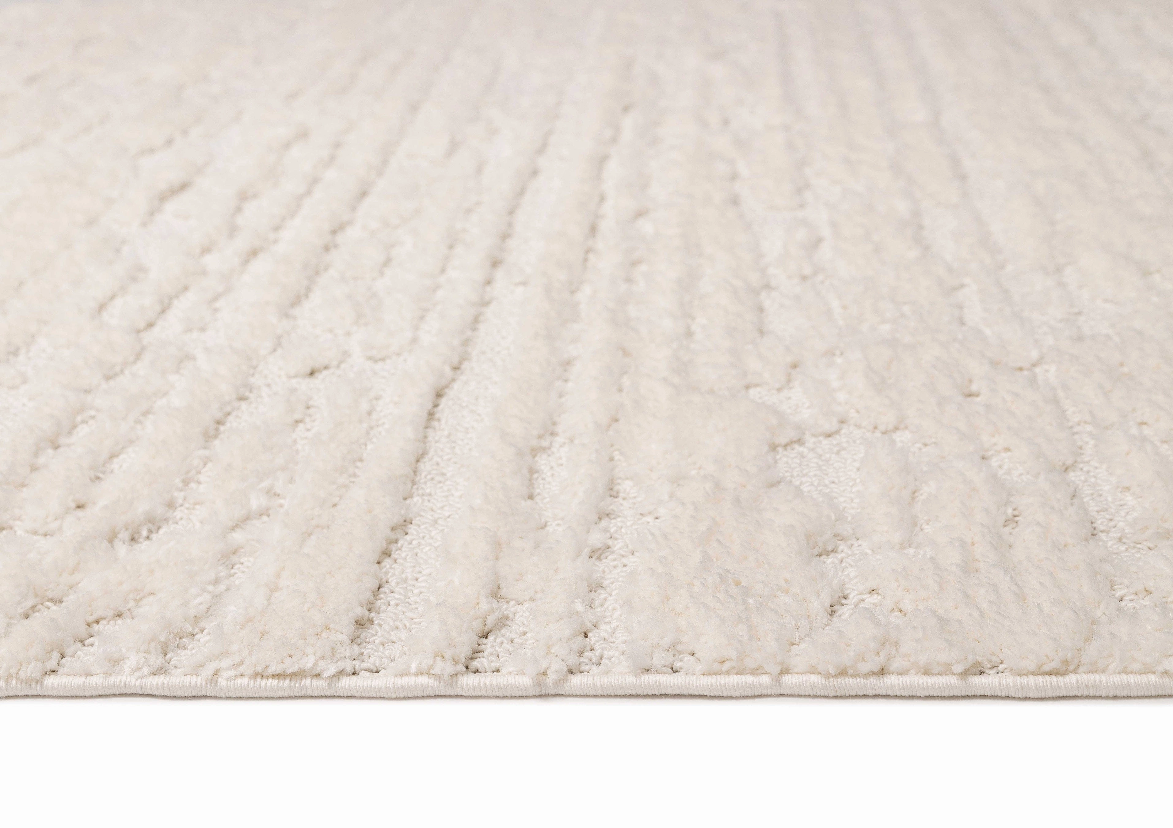 Serena Ivory Cream Textured Tassel Rug