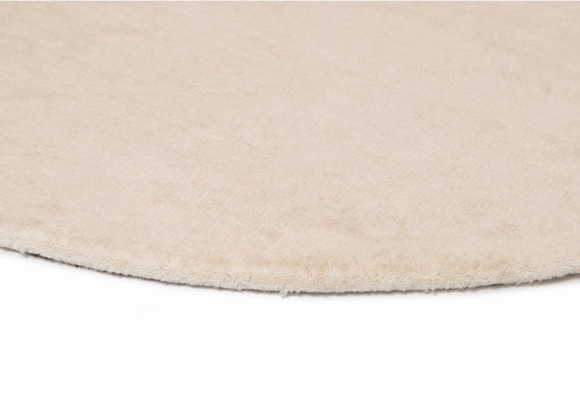 Vanni Solid Cream Curved Wool Rug